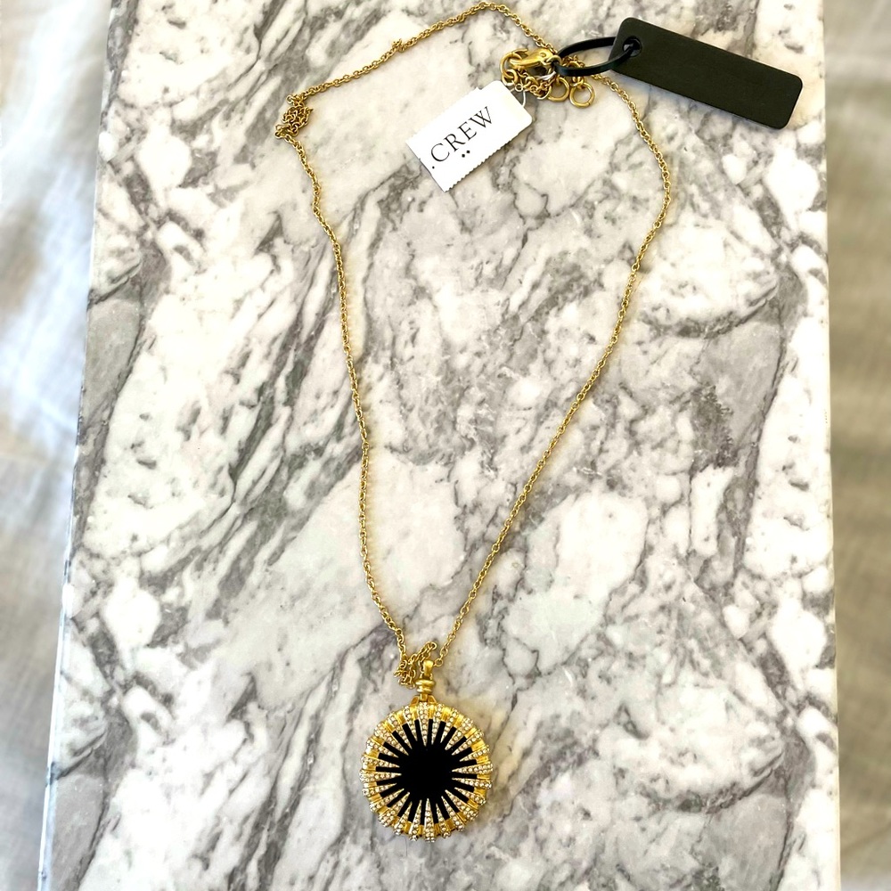 J. Crew long gold necklace with black & crystal sunburst pendant